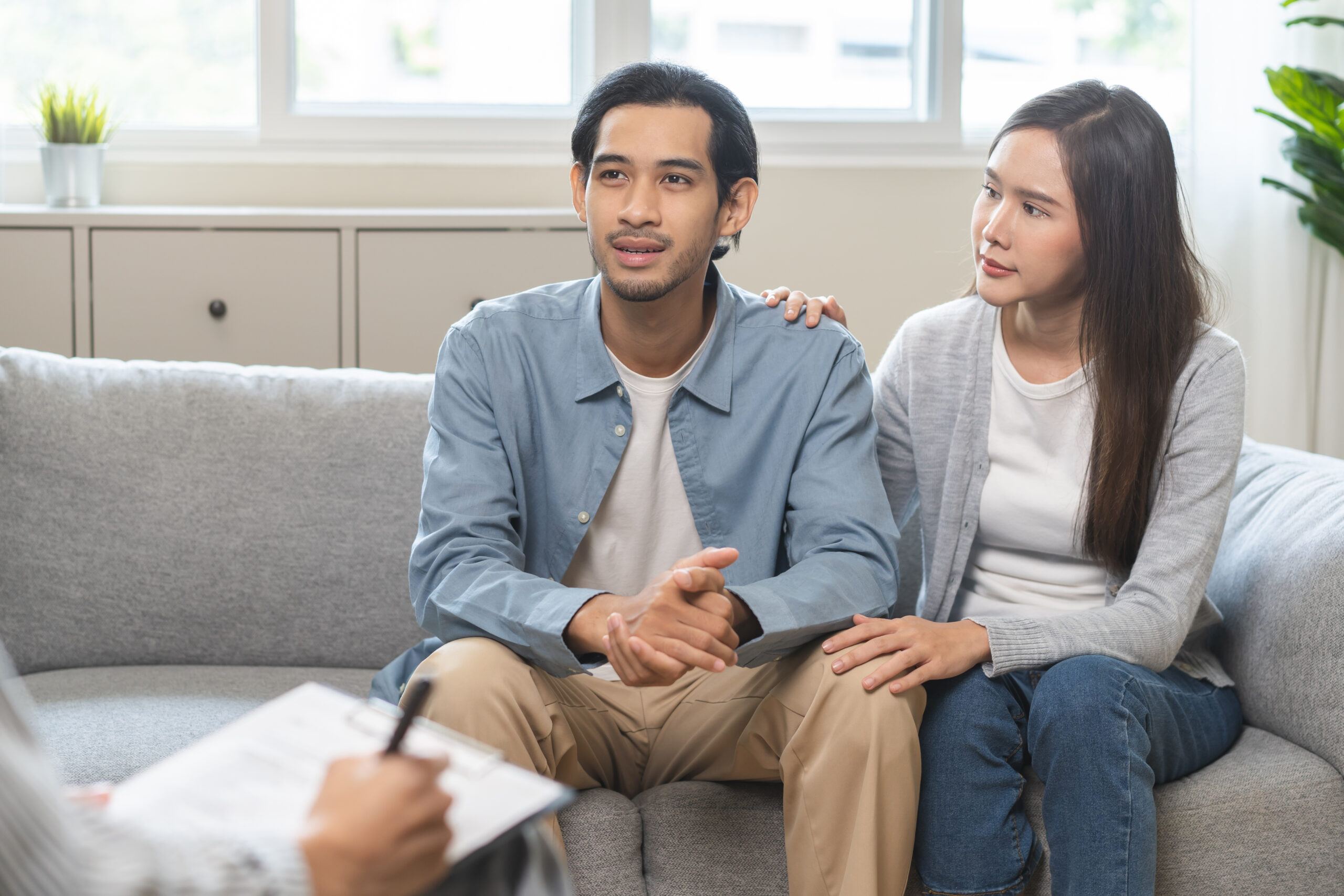 Psychology, Happy asian young woman and man couple love, consulting problem mental health together with psychologist at clinic, wife encouraging husband. Psychologist with patient sick mental therapy. Dr. Maya Matheis